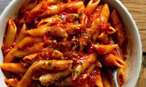 A freshly cooked bowl of Penne Arrabbiata pasta
